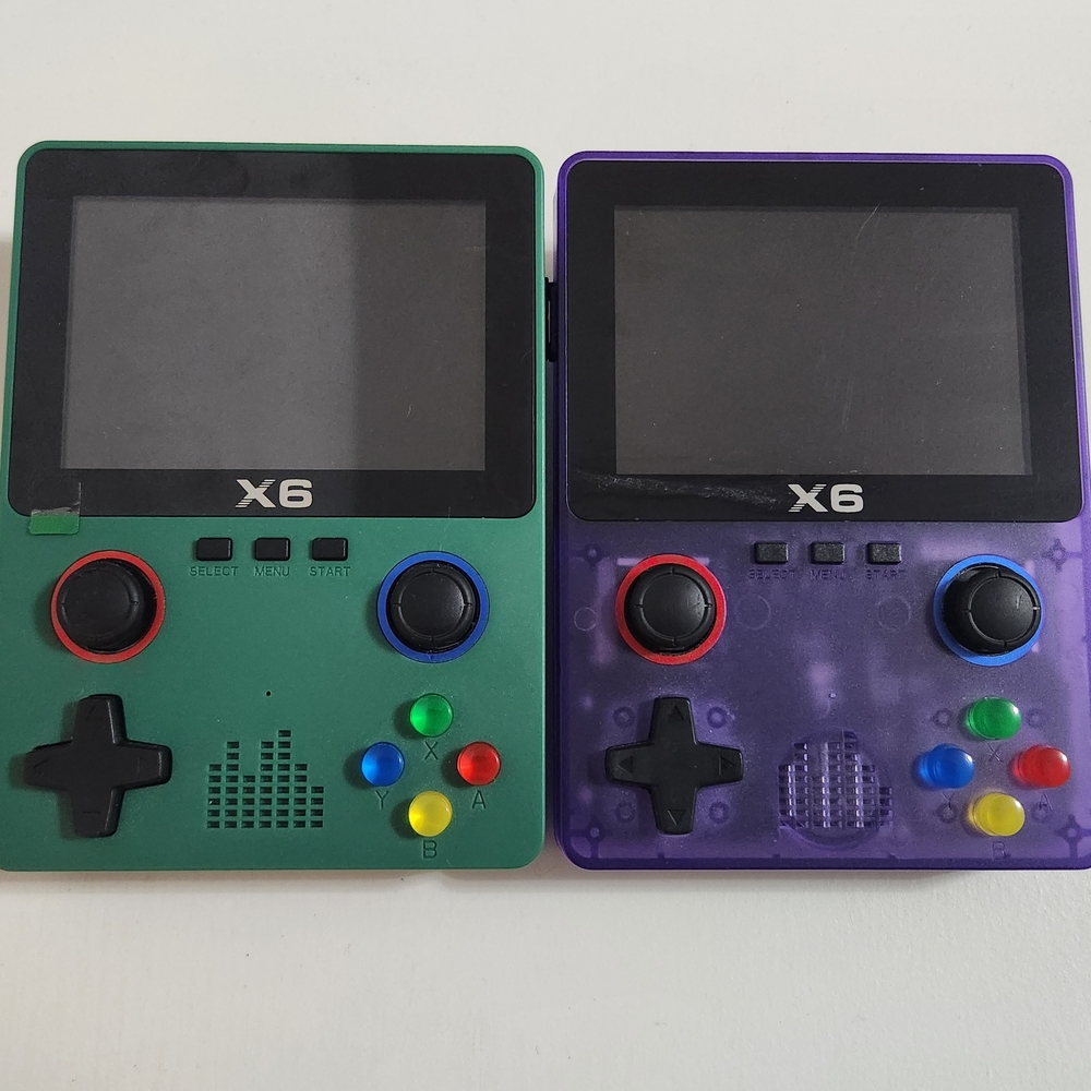Handheld Game Consoles - Green and Purple